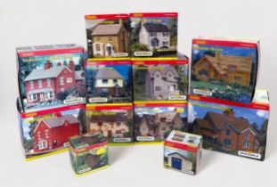 A collection of ten assorted boxed Hornby Skaledale model railway layout buildings, including, R8563