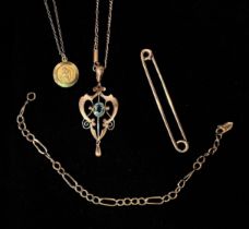 An Edwardian 9ct gold necklace and open scrollwork pendant set with a Topaz 'coloured' stone,