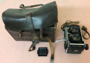 A Mamiya Professional C3 TLR camera, no.239906, with a no.19734 and no.19770 lens, with printed