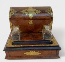 A Victorian oak and brass mounted desk tidy/ writing ciompoendium, applied Gothic Revival brass