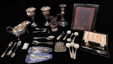 A collection of assorted silver items, comprising, various silver apostle and souvenir spoons,