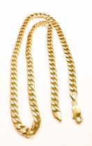 A 9ct yellow gold solid curb-link necklace chain, weighs 63.1 grams, measures 24 inches.