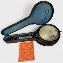 A Boosey & Co. Ltd four string banjo, with satinwood body, 82cm long, in fitted and lined hard case,