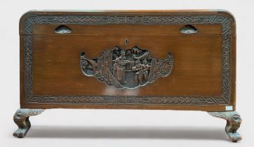 An Oriental carved camphor wood blanket chest, of rectangular form with hinged top, inset carved