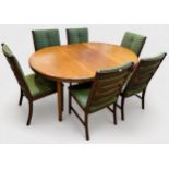 A mid-20th century teak extending dining table and six chairs, believed to be by White & Newton, the