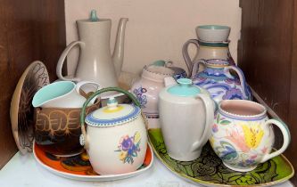 A quantity of assorted Poole Pottery, comprising, teapots, dishes, vases, etc. in various