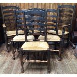 A set of six 19th Century oak and rush seated ladder back dining chairs, raised on tapering legs