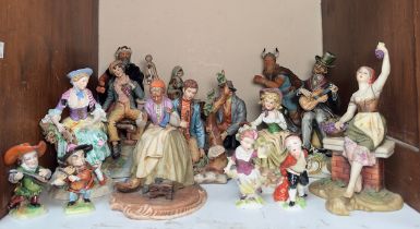 A collection of various porcelain figure groups, including Royal Doulton character figures, Good