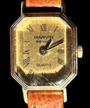 A ladies vintage 9ct gold cased Marvin Revue wristwatch, the octagonal gilt dial with Roman numerals