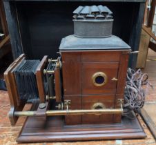 A late 19th Century mahogany and brass box camera by W. Watson & Sons, the applied brass plaque