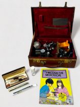 A Watson Barnet monocular microscope, numbered 128587, in brown leather carry case with various