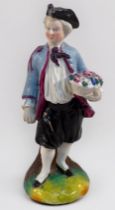 An 18th century Bow Porcelain Figure of a young man emblematic of Spring and holding a basket of