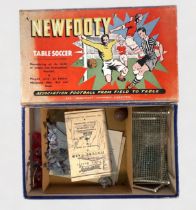 A boxed 1950s Newfooty Table Soccer game, with twenty-two players including goalkeepers, football,