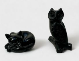 A carved and polished Shungite figure a fox, signed 'J. Picorini,' 5cm wide, together with another