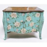 A Continental commode cupboard, of serpentine form, the walnut top above a floral painted aqua