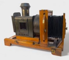 The Midland Camera Co. magic lantern, no. 3, with brass lens and fittings and bellows focusing, 69cm
