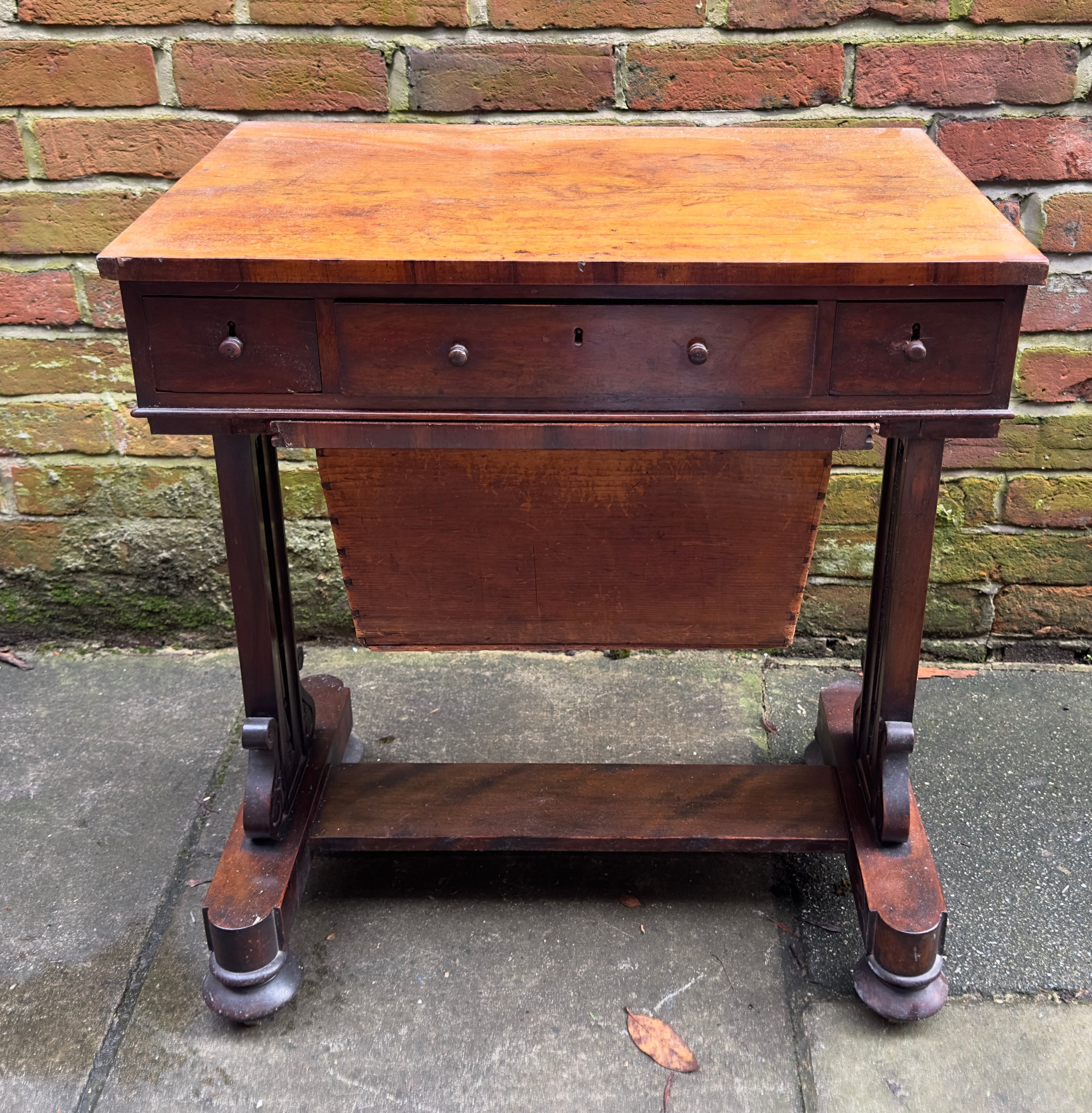 A William IV mahogany work table, with rectangular top above three frieze drawers and opposing