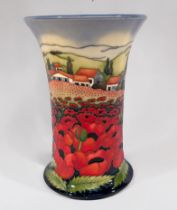 A Moorcroft pottery vase in the Avignon pattern, of cylindrical form with flared rim, designed and