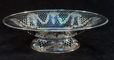 A late Victorian silver bread basket, of oval form with embossed patera, drapped swags, pierced