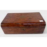 A Victorian burr walnut writing slope, the domed hinged top with brass inlay and matched flush brass