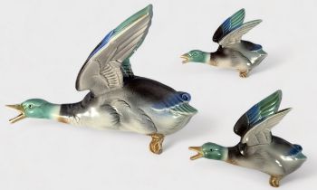 A set of three Poole Pottery Art Deco wall ornaments in the form of graduating flying Mallard