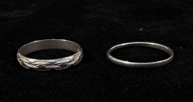 A white gold wedding ring, 3.58g, together with a platinum wedding band, 2.15g, (2)