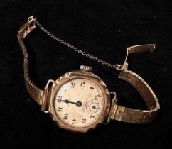 A ladies early 20th century 9ct gold cased Omega wristwatch, the silvered dial with Arabic