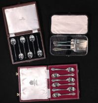 Two cased sets of six silver coffee spoons, by Mappin & Webb and Walker & Hall, together with
