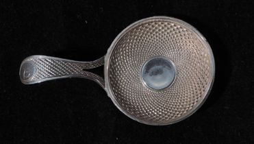 A George III silver caddy spoon by William Pugh, with decorative bowl and handle, hallmarked