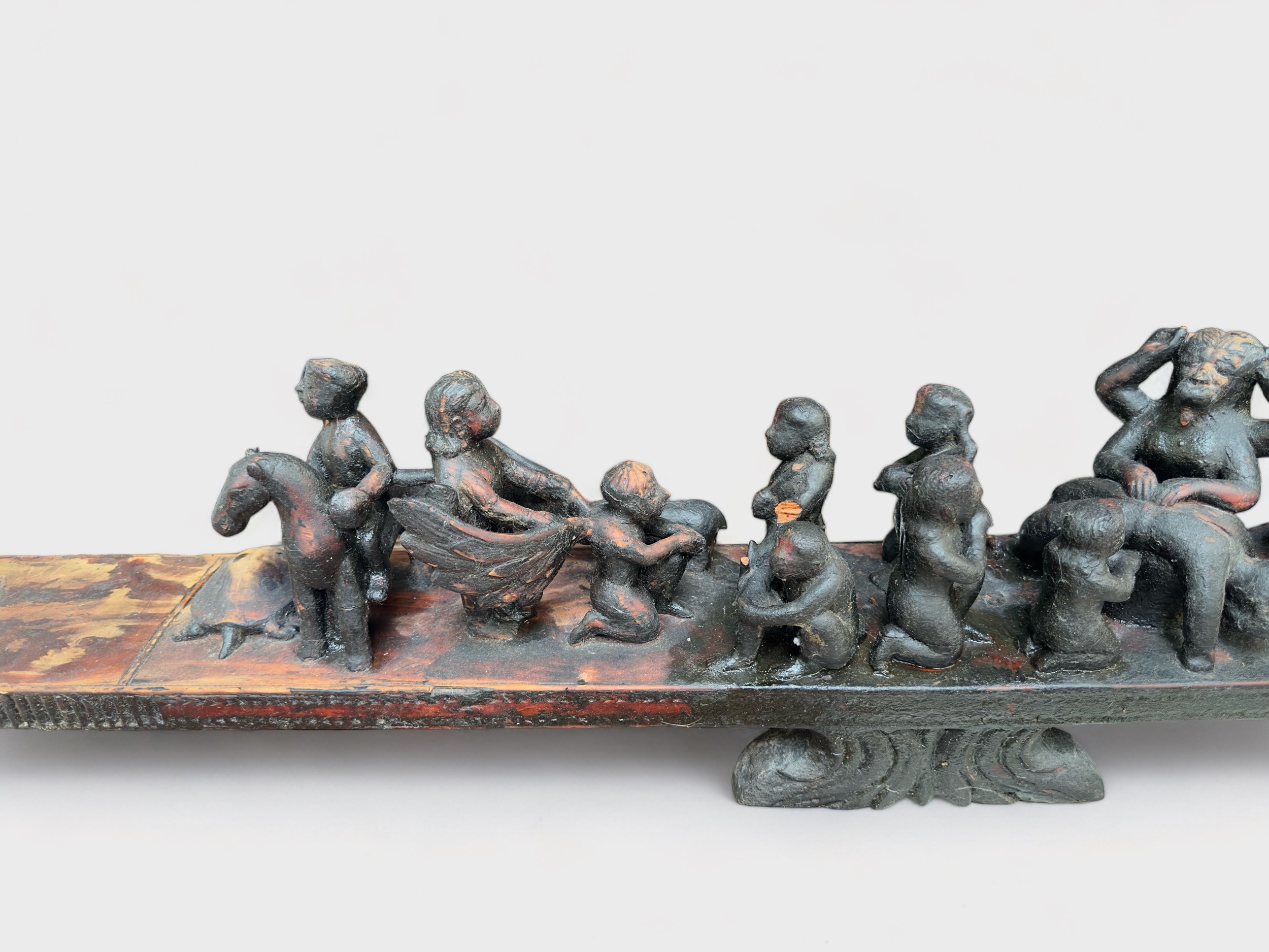 A carved hardwood altarpiece, possibly South American, modelled as a stylised boat with figures - Image 2 of 3