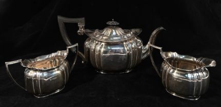 An George V silver three-piece tea set by Cooper Brothers & Sons, Sheffield, 1931, of shaped