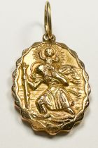 A solid 9ct yellow gold oval shaped St Christopher pendant, with wave design edge, and large round