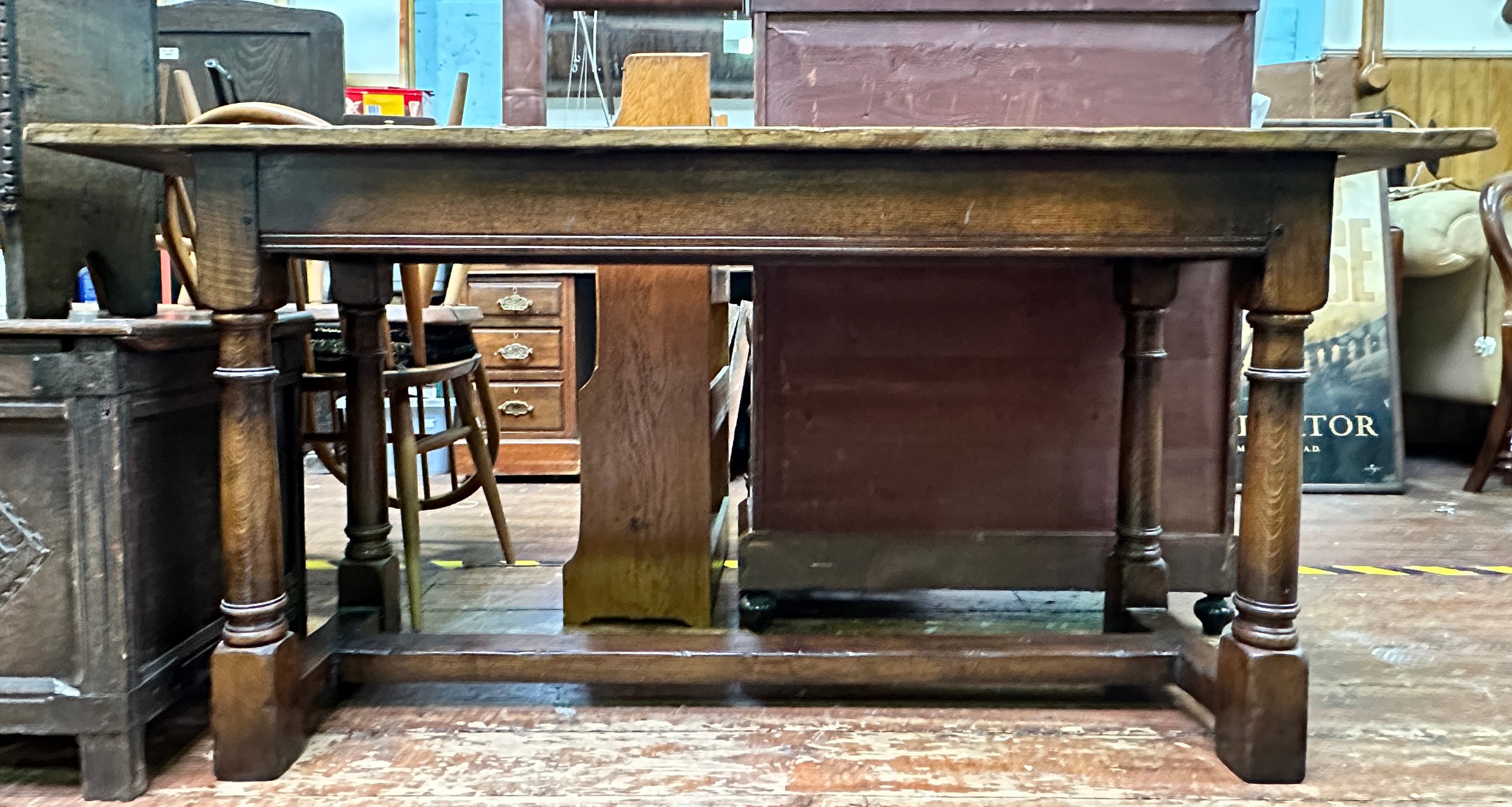 An oak hall/side table, with plank top to plain frieze, raised on turned supports united by - Image 2 of 2