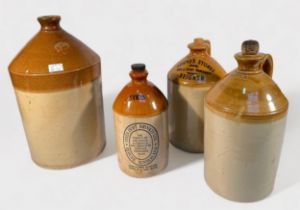 Four stoneware flagons of various sizes, including a Doulton & Co Lambeth example ‘G.S.
