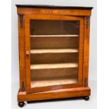 A Victorian inlaid walnut pier cabinet, with single central glazed door enclosing three shelves,