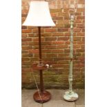 Two 20th Century solid wood floor standing standard lamps, one painted green with flora and fauna