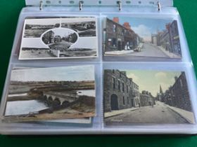 Two albums containing around 300 standard size postcards of the Northumberland area. Lots of