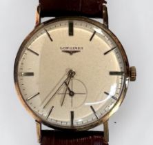 A vintage 9ct gold gents Longines wristwatch, C.1950’s, the silvered dial with batons denoting hours