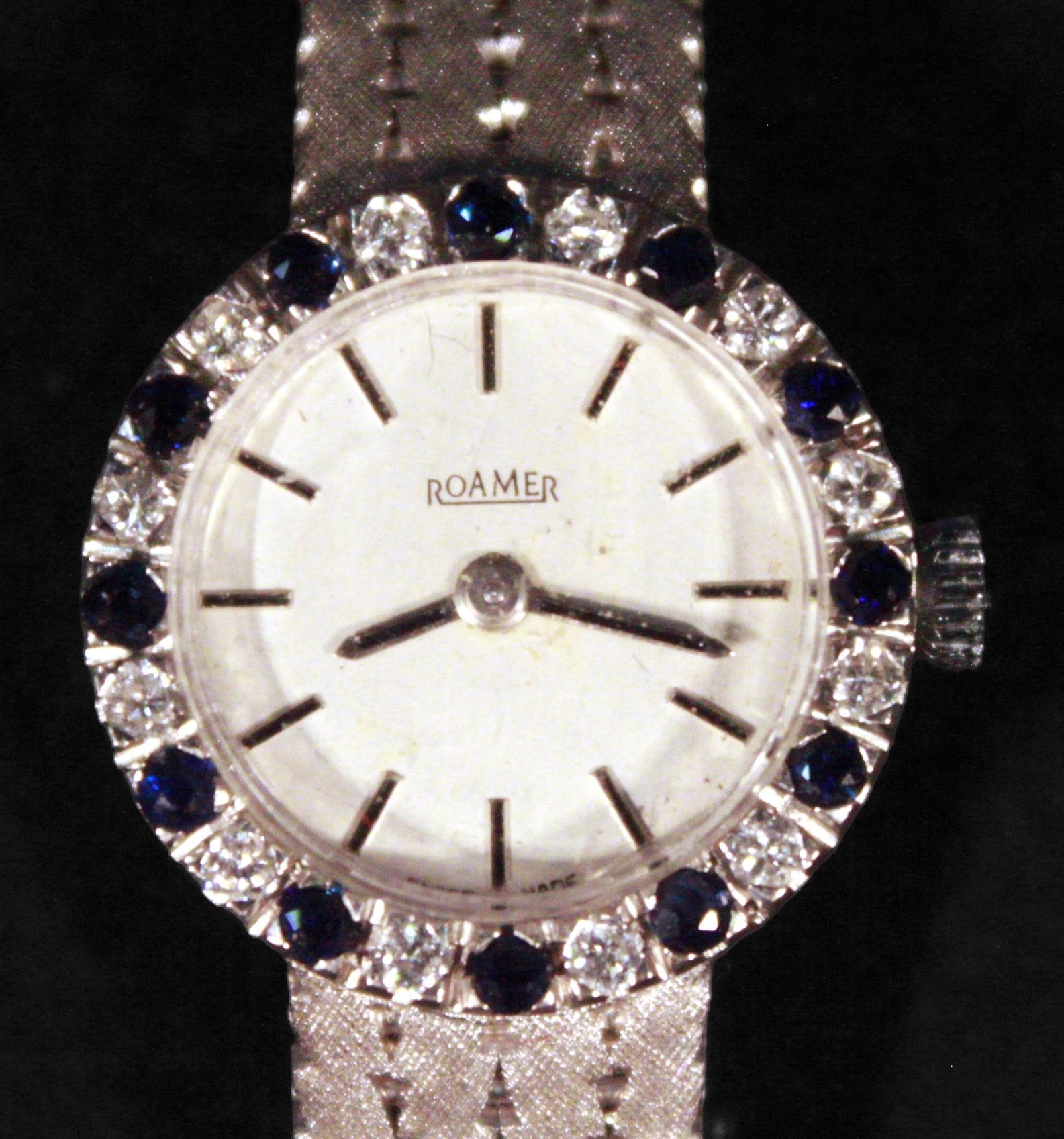 A ladies 9ct white gold wristwatch by Roamer, the silvered dial with batons denoting hours, the