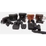 A collection of 21 assorted pairs of binoculars including a pair of Pentax 12 x 50 and examples by
