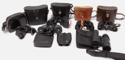 A collection of 21 assorted pairs of binoculars including a pair of Pentax 12 x 50 and examples by