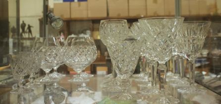 A collection of assorted Waterford Crystal glasses, including nine water goblets in the Comeragh and