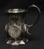 A Victorian silver Christening tankard of panelled baluster form, with foliate engraved roundels and