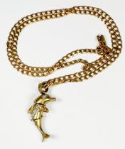 A 9ct gold curb link chain with 9ct gold articulated doilphin pendant, total weight 18.9 grams,