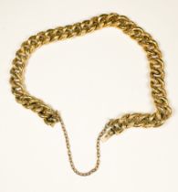 An 18ct yellow gold solid curb link bracelet, alternate patterned and plain links, with safety