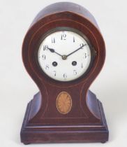 An Edwardian balloon mantel clock, with French eight-day movement by Japy Freres, striking a gong,