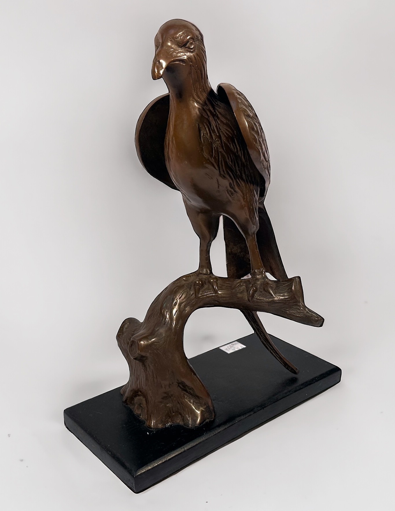 A copper alloy sculpture of an eagle perched on a branch, raised on stained wooden pedestal base, - Image 2 of 3