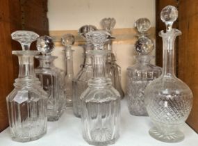 A pair of late Georgian mallet shaped decanters with star-cut bases, together with seven various