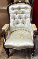 A Victorian stained mahogany open armchairs with silver and gold floral satin upholstery.