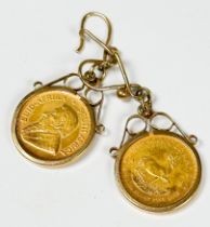 A pair of 22ct gold 1/10th Kruggerand earrings, on 9ct gold wires, total weight 8.8 grams.